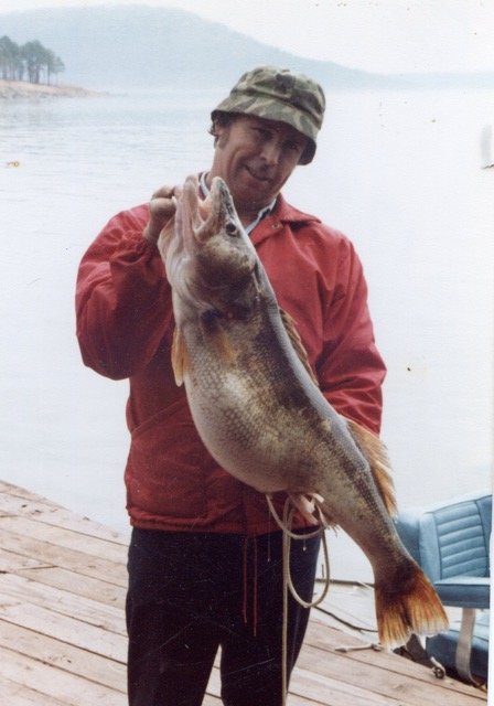 In 1972, guide Dickie Bailey holds a 20-pound-plus walleye from Greer’s Ferry’s Little Red River tributary.